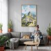 04 - Machu Picchu Watercolor Canvas Print with Natural Floater Frame - Woman Knitting on grey couch - Vertical.jpg