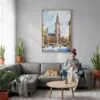 04 - Munich Marienplatz Watercolor Canvas Print with Natural Floater Frame - Woman Knitting on grey couch - Vertical.jpg