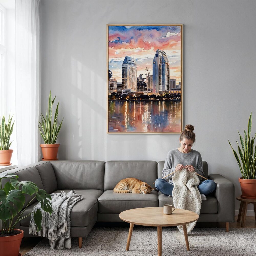 04 - San Diego Skyline Watercolor Canvas Print with Natural Floater Frame - Woman Knitting on grey couch - Vertical.jpg 04 - San Diego Skyline Watercolor Canvas Print with Natural Floater Frame - Woman Knitting on grey couch - Vertical.jpg