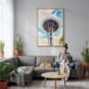 04 - Seattle Space Needle Closeup Watercolor Canvas Print with Natural Floater Frame - Woman Knitting on grey couch - Vertical.jpg