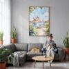 04 - Sydney Australia Opera House Watercolor Canvas Print with Natural Floater Frame - Woman Knitting on grey couch - Vertical.jpg