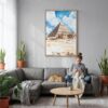 04 - The Pyramids of Giza Watercolor Canvas Print with Natural Floater Frame - Woman Knitting on grey couch - Vertical.jpg