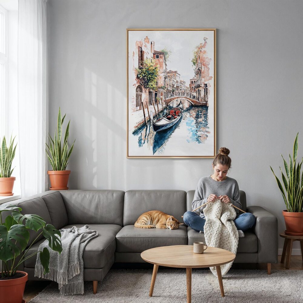 04 - Venice Gondola - Watercolor Canvas Print with Natural Floater Frame - Woman Knitting on grey couch - Vertical.jpg 04 - Venice Gondola - Watercolor Canvas Print with Natural Floater Frame - Woman Knitting on grey couch - Vertical.jpg