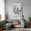 05 - Amsterdam - Watercolor 1 Canvas Print with Natural Floater Frame - Woman Knitting on grey couch - Vertical.jpg
