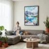 05 - Framed Banff National Park Watercolor Canvas Print - Woman Knitting on grey couch - Vertical.jpg
