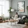 05 - Framed Cute Frog in Japanese Bathtub Illustration Canvas Print - Woman reading in Boho Living Room - Vertical.jpg