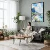 05 - Framed Hawaii - Napali - Watercolor Canvas Print - Woman reading in Boho Living Room - Vertical.jpg