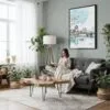 05 - Framed Hiroshima - Watercolor Canvas Print - Woman reading in Boho Living Room - Vertical.jpg
