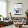 05 - Framed Hong Kong Watercolor Canvas Print - Woman Knitting on grey couch - Vertical.jpg