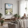 05 - Framed Napa Valley Vineyard Watercolor Canvas Print - Woman reading in modern Living Room - Vertical.jpg