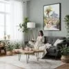 05 - Framed Rio De Janeiro Rocinha Favela Watercolor Canvas Print - Woman reading in Boho Living Room - Vertical.jpg