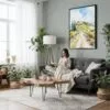 05 - Framed Tuscany Italy Watercolor Canvas Print - Woman reading in Boho Living Room - Vertical.jpg