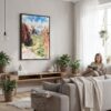 05 - Framed Zion Canyon Watercolor Canvas Print - Woman reading in modern Living Room - Vertical.jpg