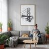 05 - Golden Gate Bridge - Pencil Drawing Canvas Print with Natural Floater Frame - Woman Knitting on grey couch - Vertical.jpg