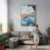 05 - Monaco France Watercolor Canvas Print with Natural Floater Frame - Woman Knitting on grey couch - Vertical.jpg