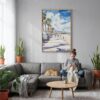 05 - Santa Monica Watercolor Canvas Print with Natural Floater Frame - Woman Knitting on grey couch - Vertical.jpg