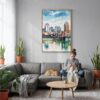 06 - Cincinnati Ohio Watercolor Canvas Print with Natural Floater Frame - Woman Knitting on grey couch - Vertical.jpg