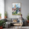 06 - Edinburgh Skyline Watercolor Canvas Print with Natural Floater Frame - Woman Knitting on grey couch - Vertical.jpg