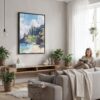 06 - Framed Hawaii - Nā Pali Watercolor Canvas Print - Woman reading in modern Living Room - Vertical.jpg