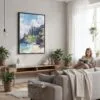 06 - Framed Hawaii - Nā Pali Watercolor Canvas Print - Woman reading in modern Living Room - Vertical.jpg
