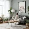 06 - Framed Japanese Macaque in Onsen Vintage Illustration Canvas Print - Woman reading in Boho Living Room - Vertical.jpg