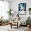 06 - Framed Nothern Lights Finland Watercolor Canvas Print - Woman reading on couch - Vertical.jpg