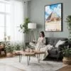 06 - Framed The Pyramids of Giza Watercolor Canvas Print - Woman reading in Boho Living Room - Vertical.jpg