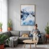 06 - Norway Watercolor Canvas Print with Natural Floater Frame - Woman Knitting on grey couch - Vertical.jpg