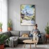 06 - Seattle Skyline - Watercolor Canvas Print with Natural Floater Frame - Woman Knitting on grey couch - Vertical.jpg
