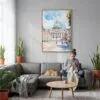 06 - The Vatican Watercolor Canvas Print with Natural Floater Frame - Woman Knitting on grey couch - Vertical.jpg