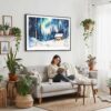 05 - Framed Finland Lapland Aurora Watercolor - Horizontal Canvas Print - Boho Living Room with Woman reading.jpg