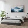 05 - Framed Misty Mountains Watercolor - Panorama Canvas Print - Woman in contemporary Bed Room.jpg