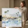 02 - Man holding Large Abstract Palm Springs Square Watercolor Canvas Print with White floater Frame.jpg