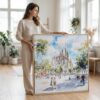 02 - Woman standing in living room with Large Sagrada familia Watercolor - Square Canvas Print with Natural floater Frame.jpg