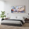 05 - Framed Los Angeles Skyline Watercolor - Panorama Canvas Print - Woman in contemporary Bed Room.jpg