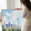 06 - Woman standing next to Large NYC Central Park Watercolor - Square Canvas Print with Natural floater Frame.jpg