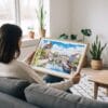 02 - A Woman Holding A Framed Strasbourg Watercolor - Horizontal Art Print.jpg