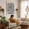 02 - Framed Phoenix City Art - Pencil Style Art Print - In Bohi Living Room with Woman reading - Vertical.jpg