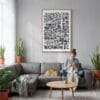02 - Washington DC City Art - Pencil Style Canvas Print with Natural Floater Frame - Woman Knitting on grey couch - Vertical.jpg