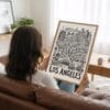 02 - Woman Holding Framed Los Angeles City Art - Pencil Style Art Print - Vertical.jpg