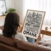 02 - Woman Holding Framed Omaha City Art - Pencil Style Art Print - Vertical.jpg