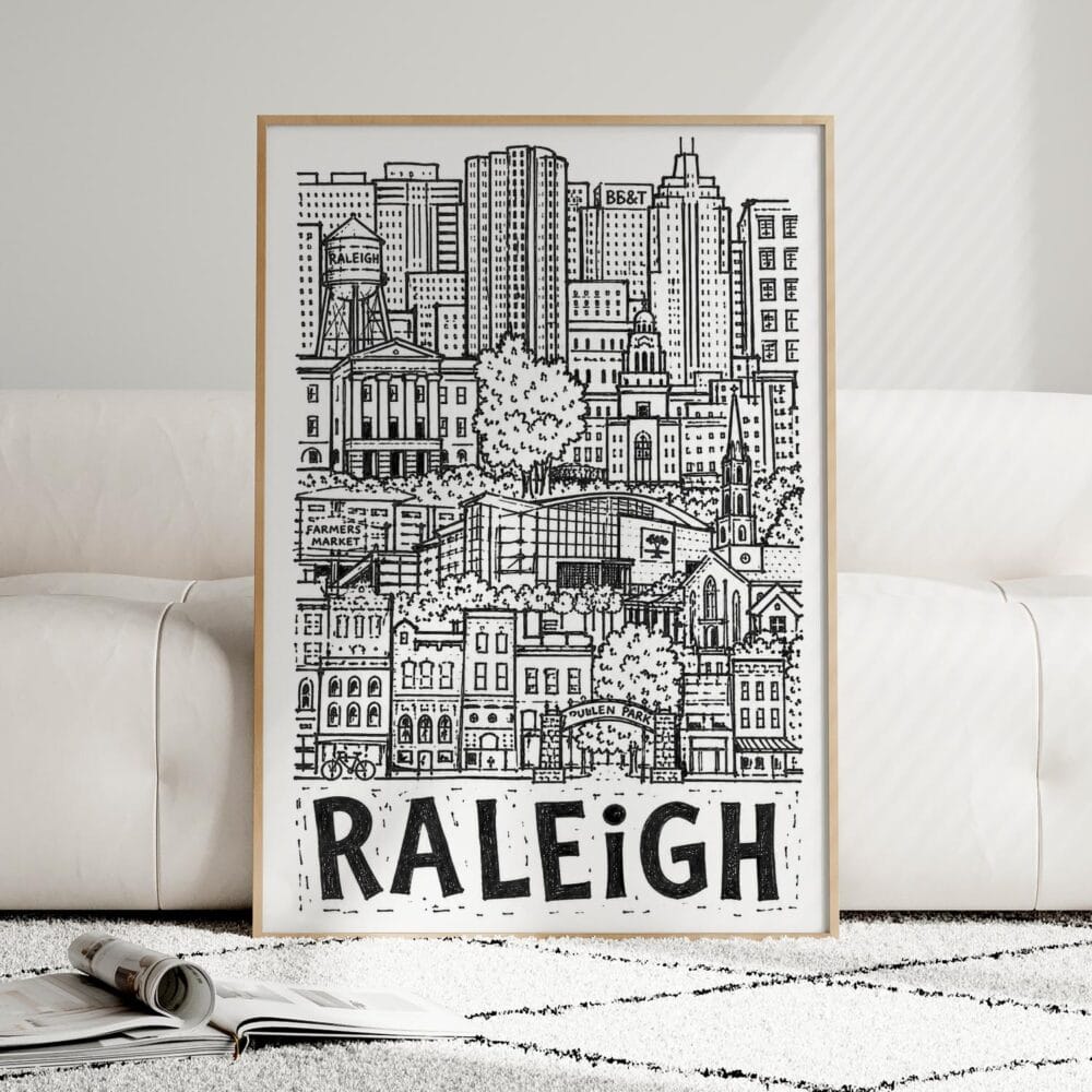 04 - Framed Raleigh City Art - Pencil Style Art Print leaning against couch - Vertical.jpg 04 - Framed Raleigh City Art - Pencil Style Art Print leaning against couch - Vertical.jpg