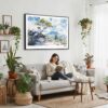 03 - Framed Hawaii Volcanoes National Park Watercolor - Horizontal-36x24 Canvas Print - Boho Living Room with Woman reading.jpg