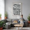 03 - Venice City Art - Pencil Style Canvas Print with Natural Floater Frame - Woman Knitting on grey couch - Vertical.jpg