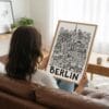 03 - Woman Holding Framed Berlin City Art - Pencil Style Art Print - Vertical.jpg