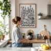 05 - Framed Shanghai City Art - Pencil Style Art Print hanging in Kitchen with woman making coffee - Vertical.jpg