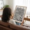 05 - Woman Holding Framed Lisbon City Art - Pencil Style Art Print - Vertical.jpg