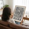 05 - Woman Holding Framed Osaka City Art - Pencil Style Art Print - Vertical.jpg