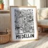 06 - Medellin City Art - Pencil Style Art Print with Natural Wood Frame on floor - Vertical.jpg